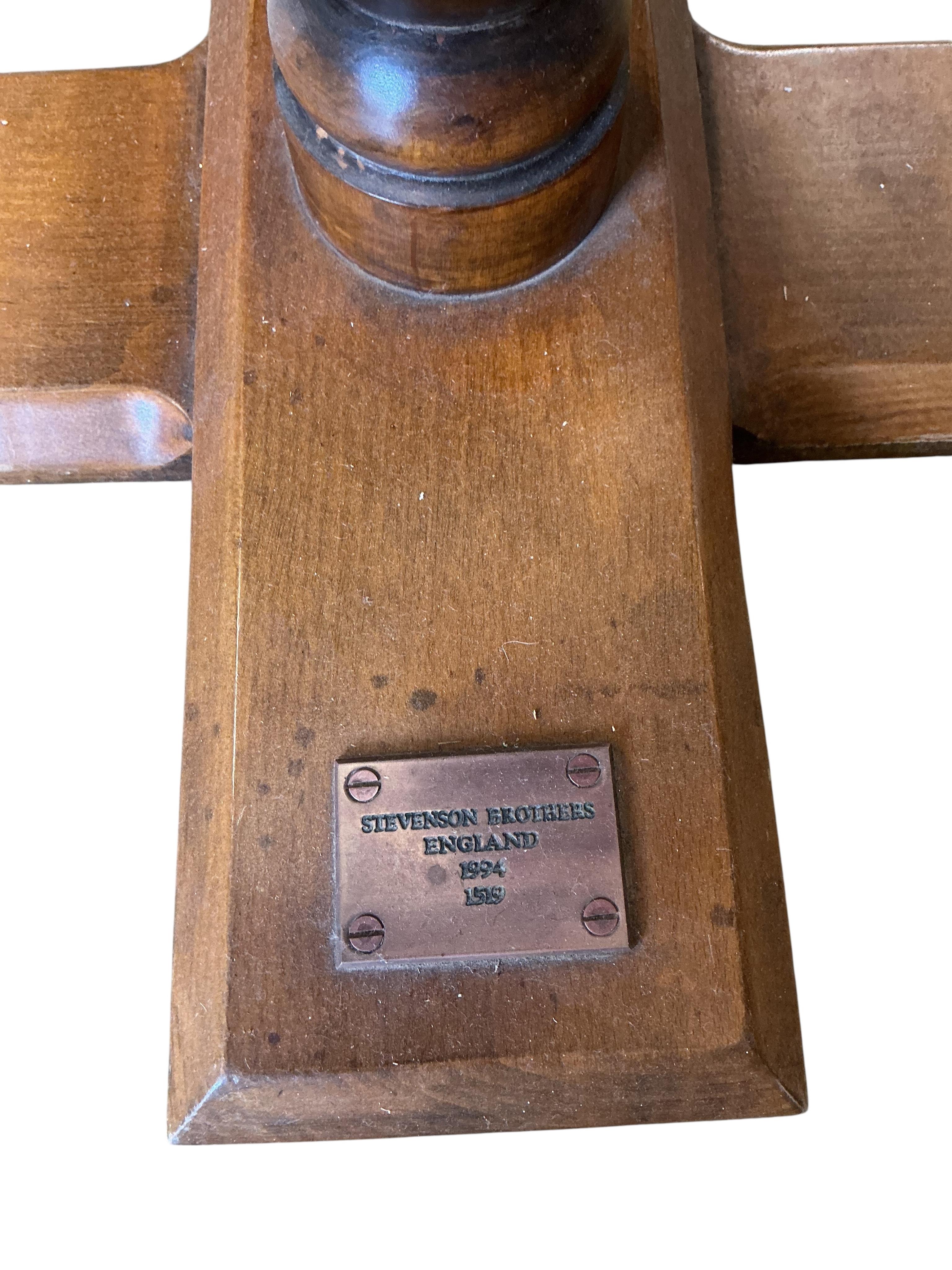 A Stevenson Brothers late 20th century dappled grey rocking horse, on a stained wood base with padded saddle, Stevenson plaque to the base dated 1994, together with a serial number 1519, additional plaque with dedication
